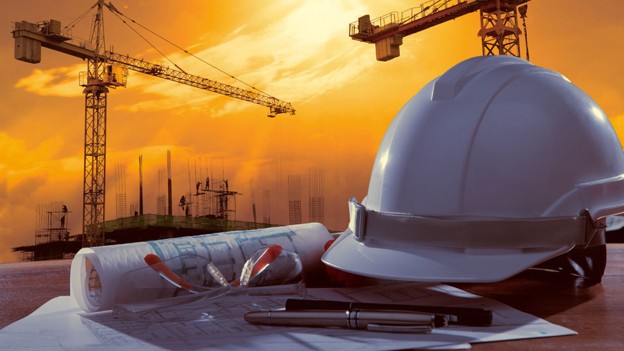 A Hard hat with a construction scene in the background